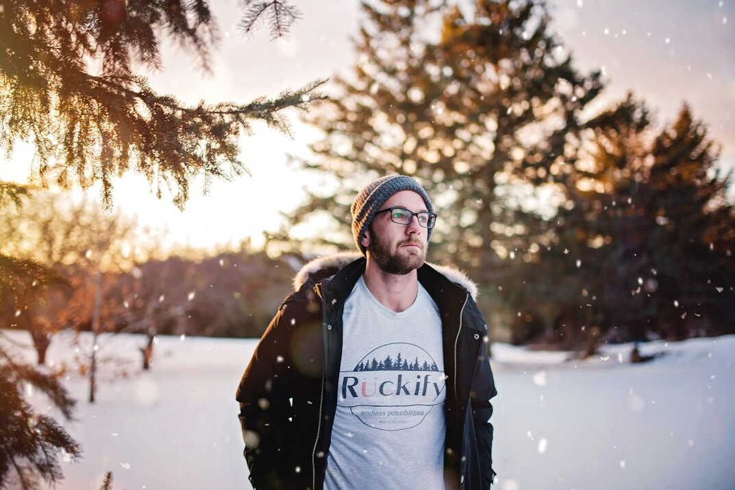 Portrait of a white Canadian male field photographer with a beard